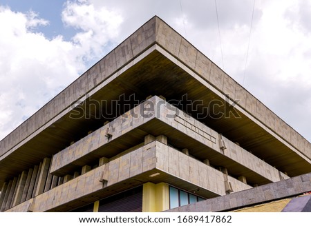 Stavropol, Russia - April 28, 2019: Palace of Culture and Sports, fragment of Soviet modernism era brutalism style building Royalty-Free Stock Photo #1689417862