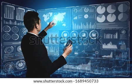 Big Data Technology for Business Finance Analytic Concept. Modern graphic interface shows massive information of business sale report, profit chart and stock market trends analysis on screen monitor. Royalty-Free Stock Photo #1689450733