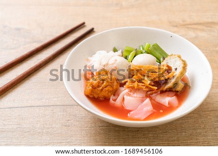 (Yen-Ta-Four) - Thai Style Noodle with assorted tofu and fish ball in Red Soup - Asian food style Royalty-Free Stock Photo #1689456106