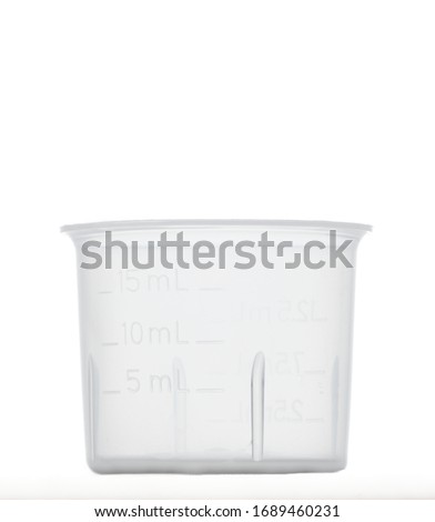 Medicine measuring cup without liquid isolated on white background Royalty-Free Stock Photo #1689460231