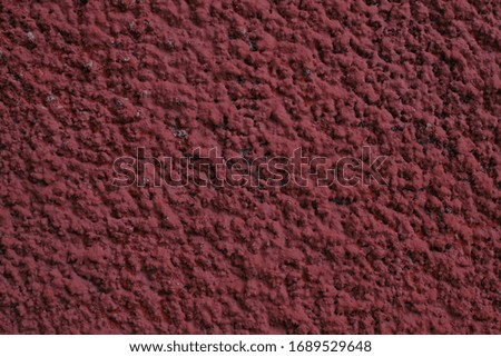 Abstract red stucco wall. Texture of an old wall covered with red stucco. background texture concrete surface background.