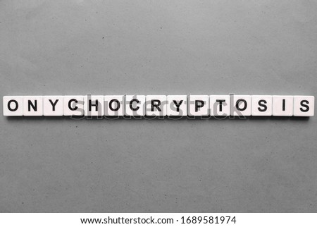Onychocryptosis, word cube with background.