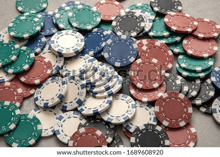 Casino chips stacked up a lot Royalty-Free Stock Photo #1689608920