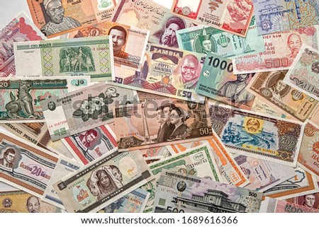 Money from various countries. A collection of bills Royalty-Free Stock Photo #1689616366
