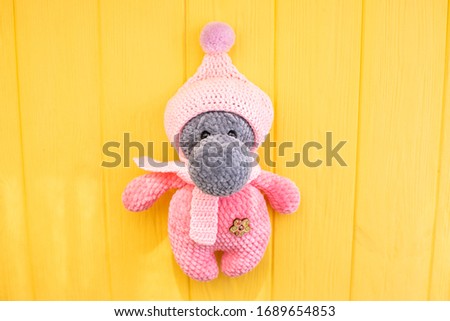 Crocheted hippo in clothes for children