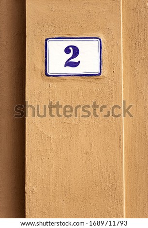 Old house number two on the orange wall, Bologna downtown, Emilia-Romagna, Italy, Europe