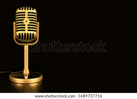 Retro microphone of gold on black background