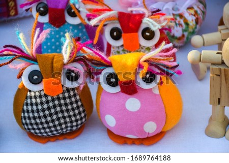 Stuffed small funny owls. Beautiful nice handicraft artisanal souvenir ideal for gift for friends family, kids and children. Cute colorful romanian traditional produce