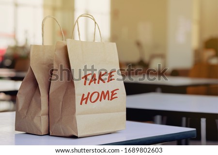 A woman order some food take home for eating in house during self quarantined, COVID-19 crisis  Royalty-Free Stock Photo #1689802603