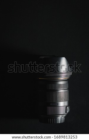 Single black DSLR standard zoom lens.