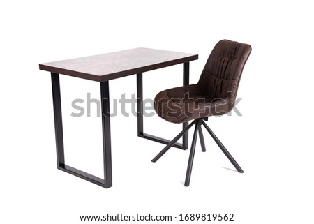 Wooden brown table and chair on a white background.A brown wooden table and a chair for the kitchen-living room. Table and chair with wooden legs.