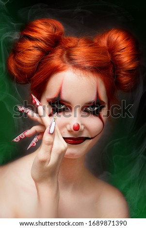 the girl with the clown makeup on a black background, Joker makeup