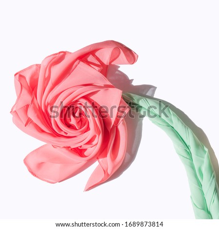 Chiffon scarf on a white background. Photo for the site. Chiffon scarf in the shape of a flower. Handkerchief. Artificial flower. Abstract flower