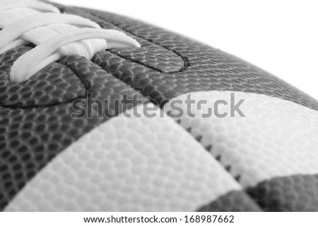 American Football - This is a high key black and white image of a football. Shot with a shallow depth of field with a white background.