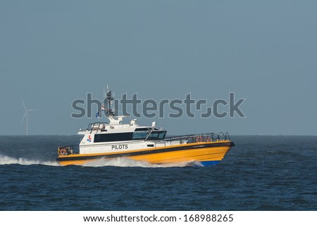 Dutch pilot vessel at IJmuiden harbor in the Netherlands Royalty-Free Stock Photo #168988265