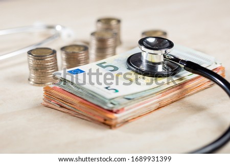 still life stethoscope with euro banknotes Royalty-Free Stock Photo #1689931399