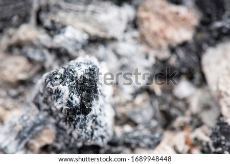 Abstract background texture of burnt ash. Coals in an extinct fire.