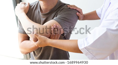 Professional therapists are stretching muscles, patients with abnormal muscular symptoms, physical rehabilitation therapies and treatment of physiological disorders by physiotherapists concept. Royalty-Free Stock Photo #1689964930