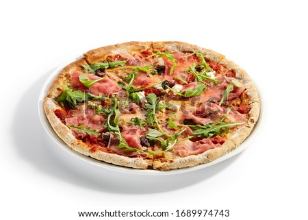 Pizza with parma ham and artichoke. Delicious italian meal with prosciutto. Traditional baked dish decorated with aromatic arugula and meat. Traditional european recipe, culinary presentation 