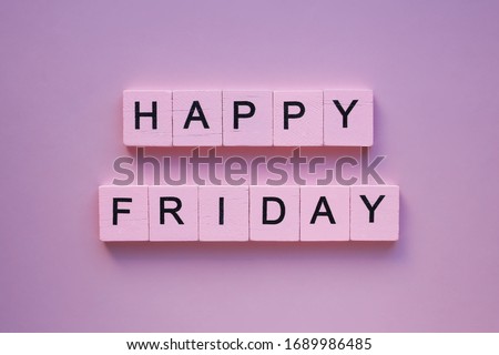 Happy friday words wooden cubes on a pink background