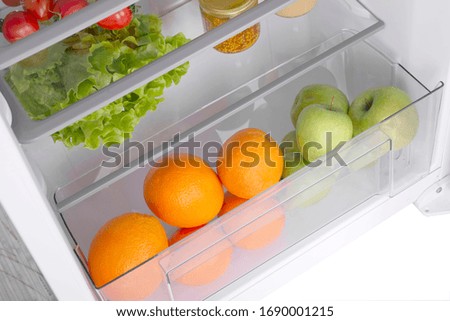 Open fridge full of fresh fruits and vegetables, healthy food background, organic nutrition, health care, dieting concept