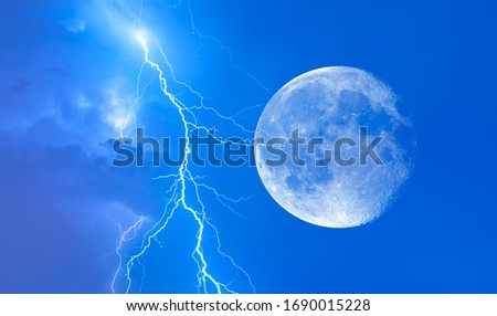 Night sky with clouds on the background flashes of lightning "Elements of this image furnished by NASA"   