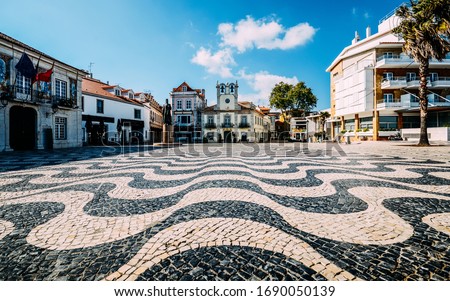 Empty Central square 5th October in Cascais with statue of Dom Pedro I. Cascais is famous and popular summer vacation spot for Portuguese and foreign tourists. Royalty-Free Stock Photo #1690050139