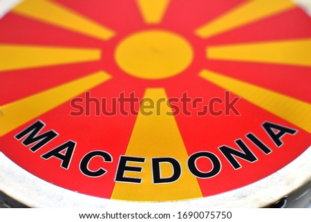 Tambourine drum with Macedonian flag on it isolated on white