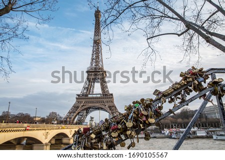 View on the famous paris eiffel tower from the promenade of the Seine . Royalty-Free Stock Photo #1690105567