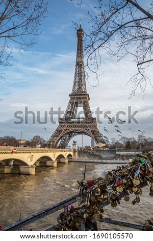 View on the famous paris eiffel tower from the promenade of the Seine . Royalty-Free Stock Photo #1690105570