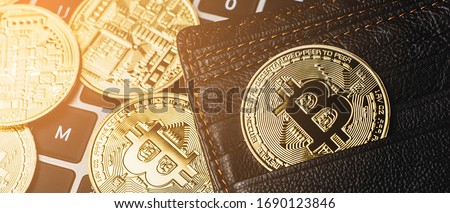 Group of bitcoin place on wallet. Online payment technology, digital wallet, computer financial,digital blockchain,  bitcoint stock, cryptocurrency trading and mining investment concept.
 Royalty-Free Stock Photo #1690123846