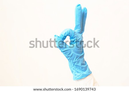Child Scary Hands In A blue Latex Gloves. Sing okay