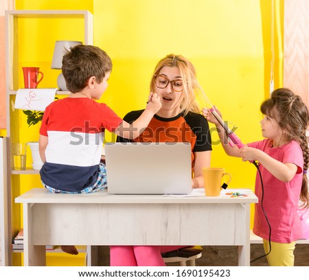 Busy mom work from home with bored children. Home office for business mother. 