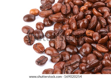 Brown coffee beans on a white background