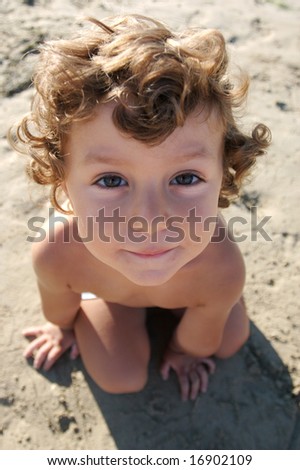 Funny photo of the child on the beach, taken from above