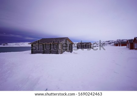 Abandoned house and building in Teriberka in winter season with cloudy sky, Murmansk, Russia 