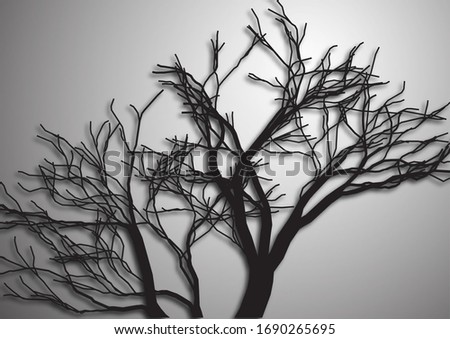 A tree without leaves. Silhouette isolated black on a gray background. Vector illustration for your design.