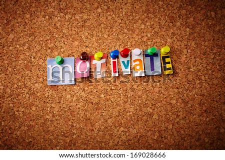Motivate - Cut out letters pinned on a notice board.