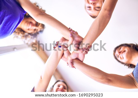 Young beautiful sportwomen doing gesture with hands
