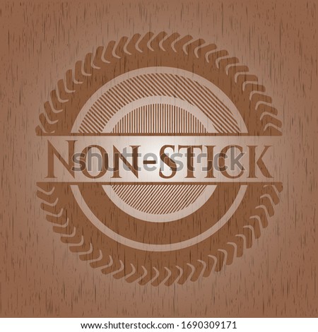 Non-stick badge with wooden background