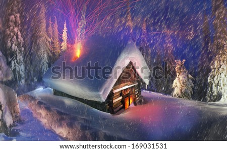 Climbing to tourist wild alpine mountain to an abandoned cabin-in order to illuminate the snow-covered spruce canopy during moonrise, moonset, to see the first star of Christmas in the Carpathians 