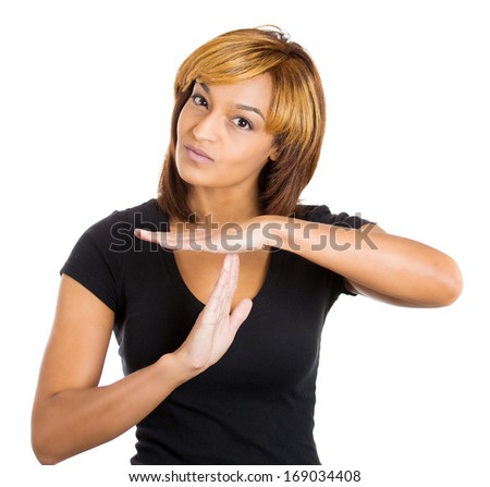 Closeup portrait of young beautiful woman teenager making time-out sign with hands, isolated on white background. Human emotion facial expressions and symbols