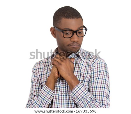 Closeup portrait of a young nerdy looking man with glasses, very timid, suspicious shy and anxious looking away down isolated on white background. Mental health, emotion facial expression feeling