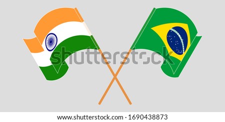 Crossed and waving flags of Brazil and India