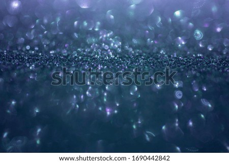 Blue purple violet sparkling bokeh texture background