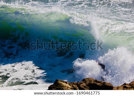 Picture of a wave taken at Cowell’s beach in Santa Cruz, California shows a nice contrast between the wave and water.