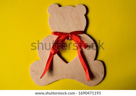 Picture of a cute teddy bear with a red bow