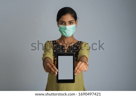 woman hand showing smart mobile phone with safety medical face mask, Health care and infection concept