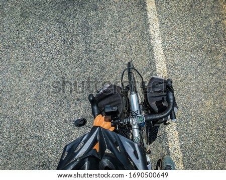top view of a cyclist on an asphalt road