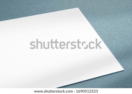 Blank business card on textured grey background close-up view as template for design, logo, embossing presentation, promotion, branding etc.